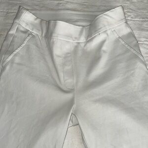 White pants by Spanx. coating on inside to prevent seeing through the white